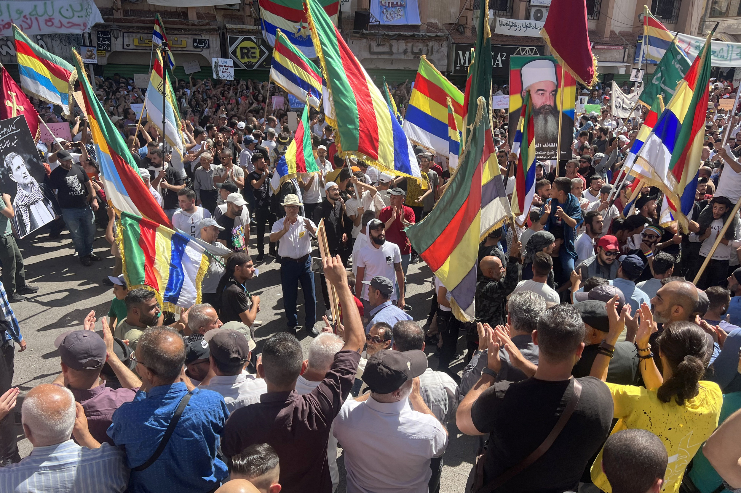 Protesters rally during an anti-government demonstration in Syria's southern city of Sweida on September 29, 2023. Peaceful protests have swept Sweida province, the heartland of the country's Druze minority, since President Bashar al-Assad's government ended fuel subsidies last month. (Photo by Sam HARIRI / AFP)