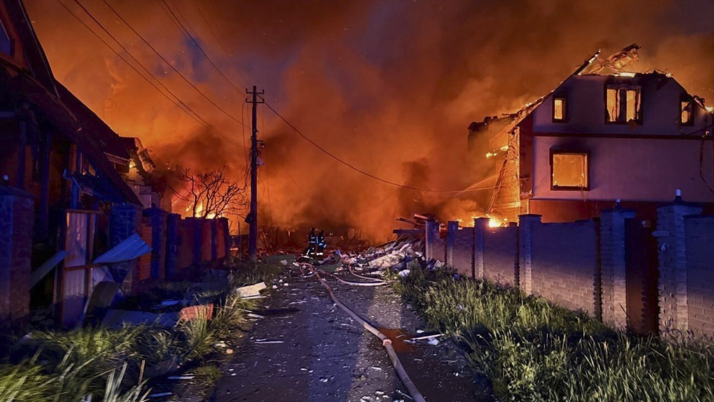 In this photo provided by the Ukrainian Emergency Service, firefighters try to put out a fire following a Russian attack in Kyiv region, Ukraine, Sunday, May 25, 2025. (Ukrainian Emergency Service via AP)