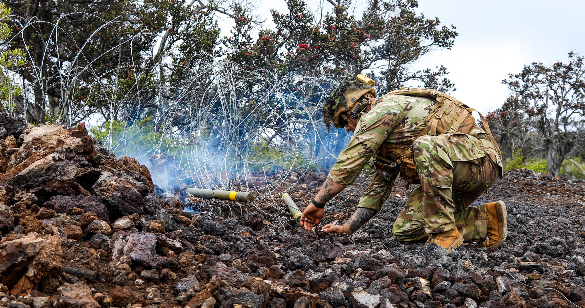 A U.S. Army Soldier assigned to 29th Brigade Engineer Battalion, 3rd Infantry Brigade Combat Team, 25th Infantry Division prepares a Bangalore breach during a live fire exercise une 1, 2023 at Pohakuloa Training Area, Hawaii. Soldiers demonstrated their tactical skills and knowledge while performing both day and night live fire training.  (U.S. Army photo by Spc. Darbi Colson/3rd Infantry Brigade Combat Team)