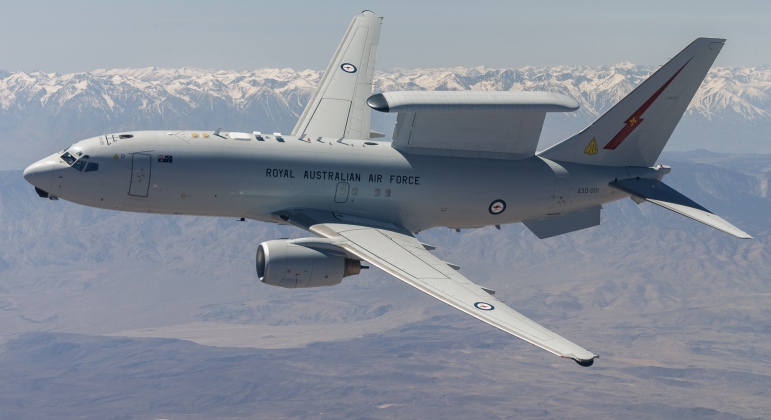 A Royal Australian Air Force E-7A Wedgetail soars over Southern California. Aircrews from the USAF, RAAF, and Royal Air Force worked together to rapidly certify the RAAF E-7A with the United States Air Force KC-46A. The trilateral test also allowed the United Kingdom and United States Air Force to gain early test experience ahead of their anticipated fielding of E-7 aircraft variants. (Air Force photo by Richard Gonzales)