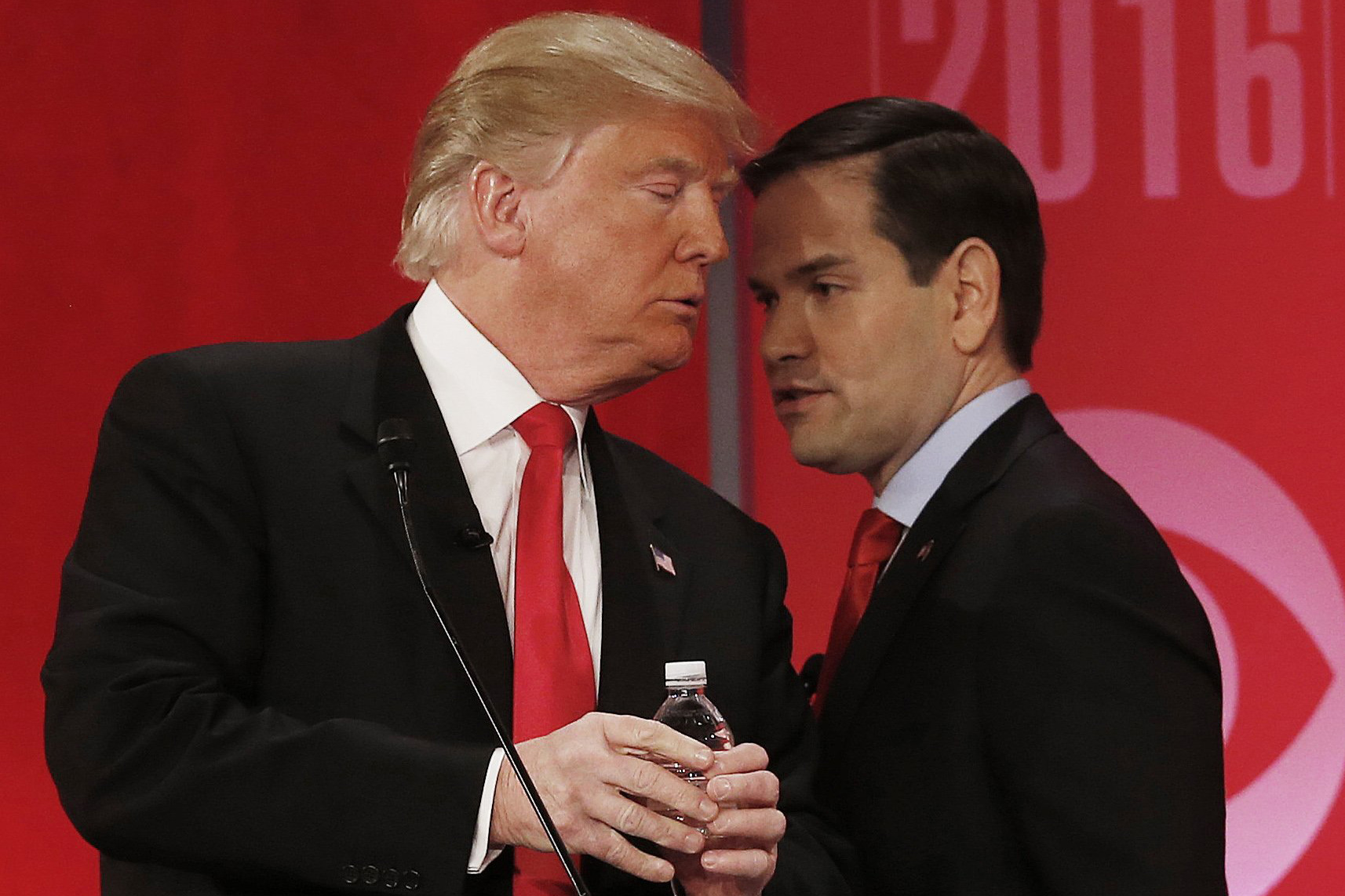 Republican presidential candidate, Sen. Marco Rubio, R-Fla., right, right, speaks to Republican presidential candidate, businessman Donald Trump  during a commercial break during the CBS News Republican presidential debate at the Peace Center, Saturday, Feb. 13, 2016, in Greenville, S.C. (AP Photo/John Bazemore) 