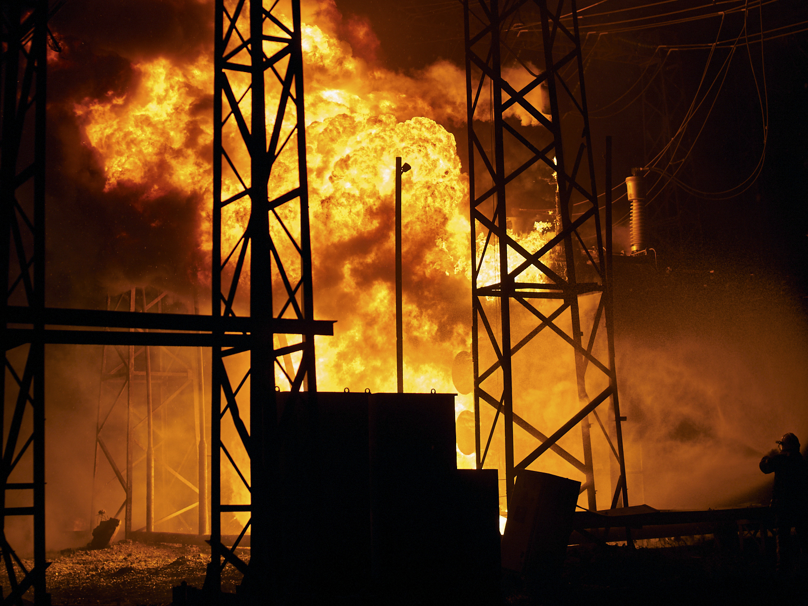 Ukrainian State Emergency Service firefighters put out the fire after a Russian rocket attack hit an electric power station in Kharkiv, Ukraine, Sunday, Sept. 11, 2022. The Kharkiv and Donetsk regions have been completely de-energised in the rocket attack.(AP Photo/Kostiantyn Liberov)
