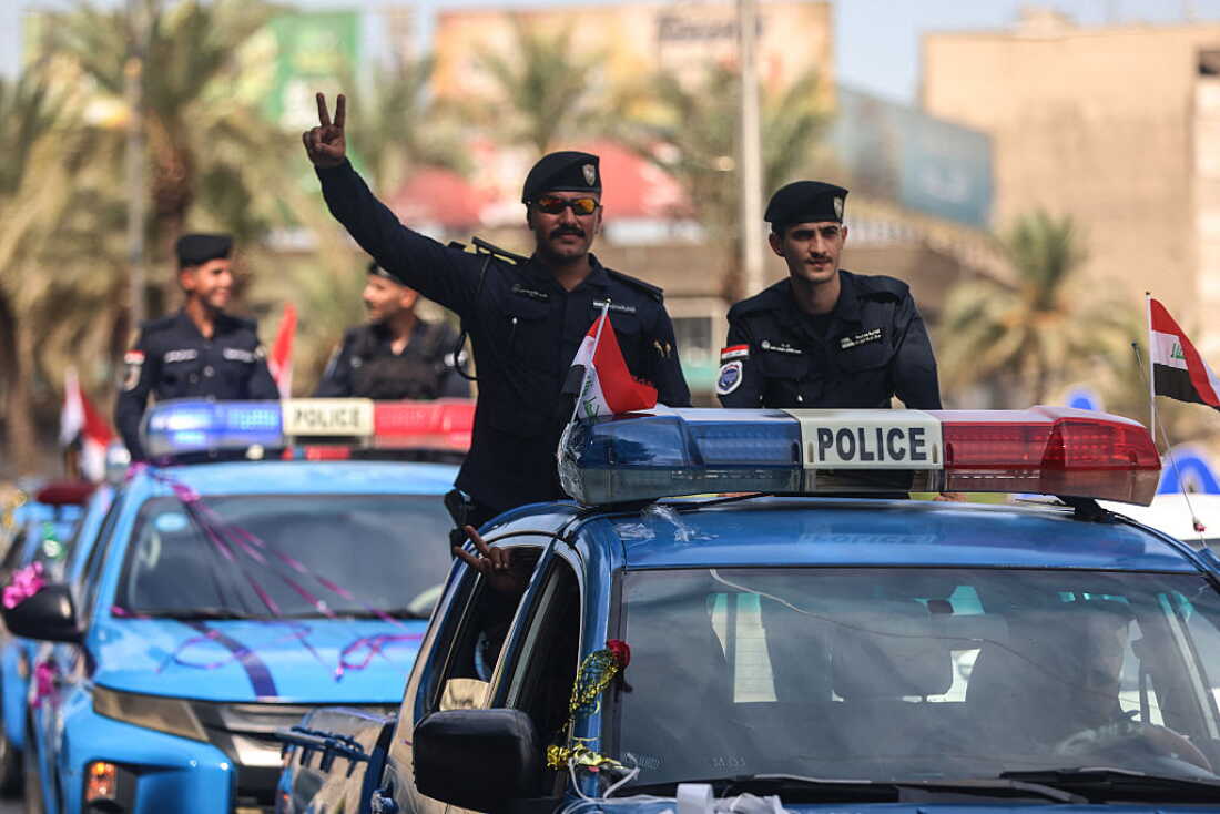 Members of the Iraqi security forces flash the V-sign for victory during a military parade marking the withdrawal of the US-led coalition from Iraq in Baghdad on September 30, 2026. A US-led coalition deployed in Iraq more than a decade ago to fight jihadists concluded its mission on September 30, a move celebrated by the country's leaders, but which some fear will embolden pro-Iran armed factions. (Photo by AHMAD AL-RUBAYE / AFP)