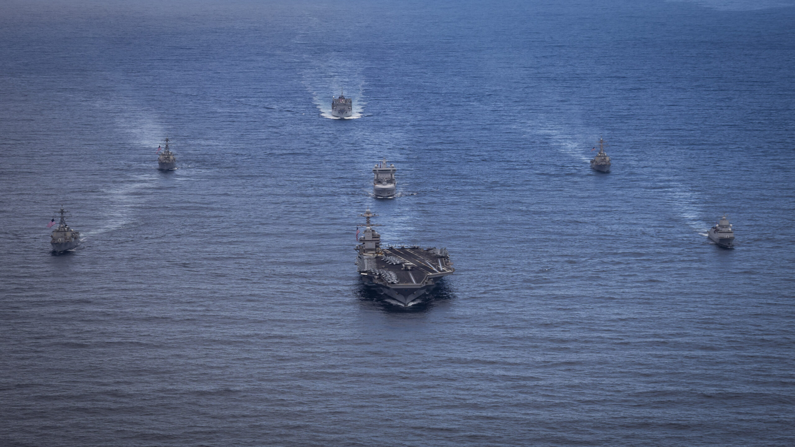 The world's largest aircraft carrier, USS Gerald R. Ford (CVN 78), front, Norwegian Navy Frigate HNoMS Thor Heyerdahl (F314), front right, Arleigh Burke-class guided-missile destroyer USS Bainbridge (DDG 96), front left, Norwegian Navy replenishment oiler HNoMS Maud (A 530), center, Arleigh Burke-class guided-missile destroyers USS Winston S. Churchill (DDG 81), back left, and USS Mahan (DDG 72), back right, and fast-combat support ship USNS Supply (T-AOE 6), sail in formation in the North Sea, Aug. 23, 2025. Gerald R. Ford, a first-in-class aircraft carrier and deployed flagship of Carrier Strike Group Twelve, is on a scheduled deployment in the U.S. 6th Fleet area of operations to support the warfighting effectiveness, lethality and readiness of U.S. Naval Forces Europe-Africa, and defend U.S., Allied and partner interests in the region. (U.S. Navy photo by Mass Communication Specialist 2nd Class Tajh Payne)