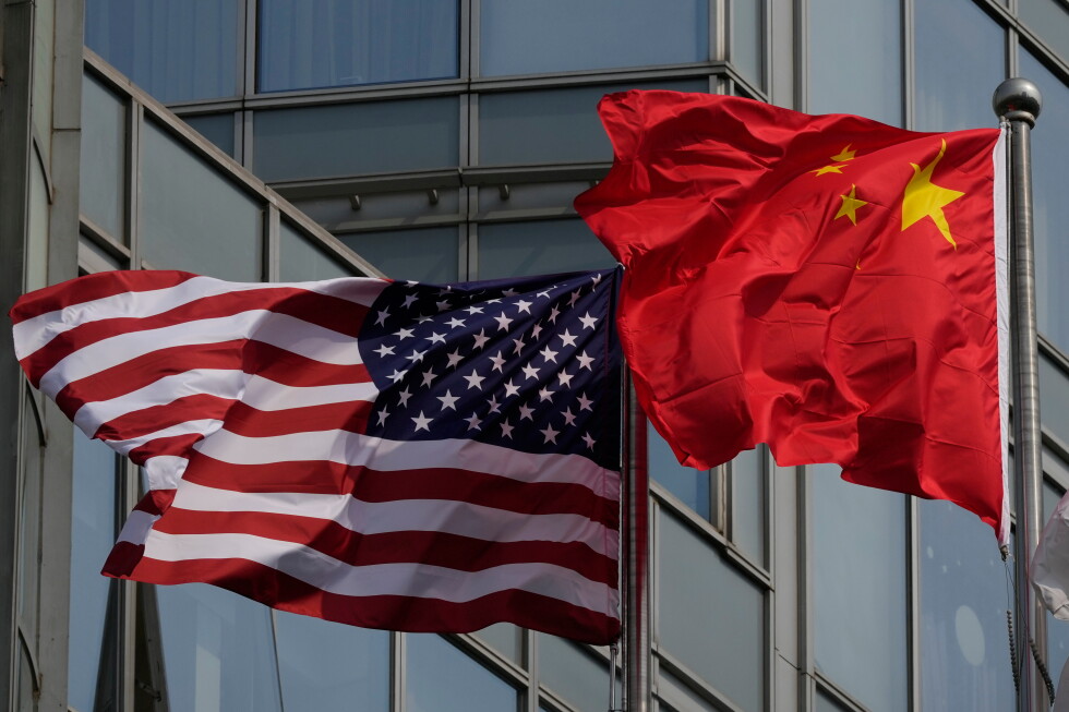 The United States and Chinese flags are flown outside a hotel expected to be used for U.S. President Donald Trump's visit to Beijing Wednesday, May 13, 2026. (AP Photo/Ng Han Guan)