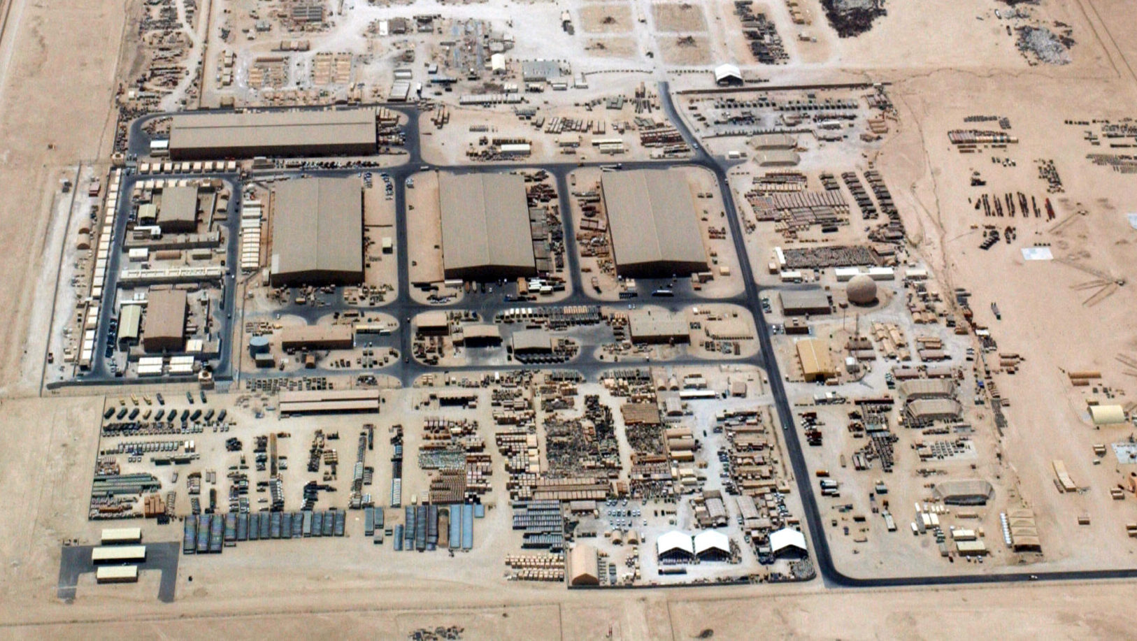 An aerial overhead view of "Ops Town" at at Al Udeid Air Base (AB), Al Rayyan Province, Qatar (QAT), taken from a US Air Force (USAF) KC-135 Stratotanker during Operation IRAQI FREEDOM.