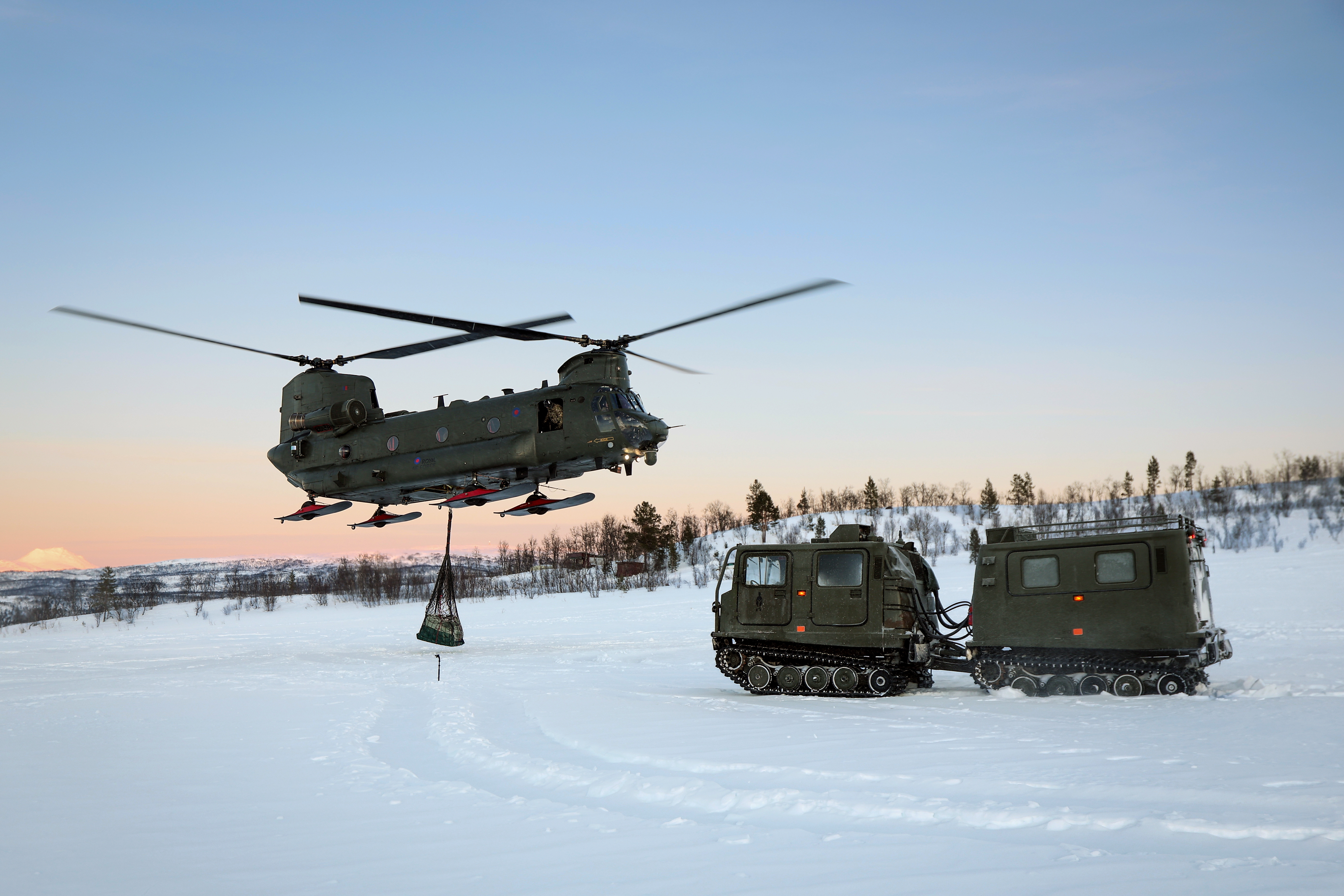 19 Jan 2026 - Royal Air Force Chinooks from 18 Squadron based at RAF Odiham have conducted load lifting training in Bardufoss, Norway during Operation Clockwork. Working with Royal Marine BV all-terrain vehicle.