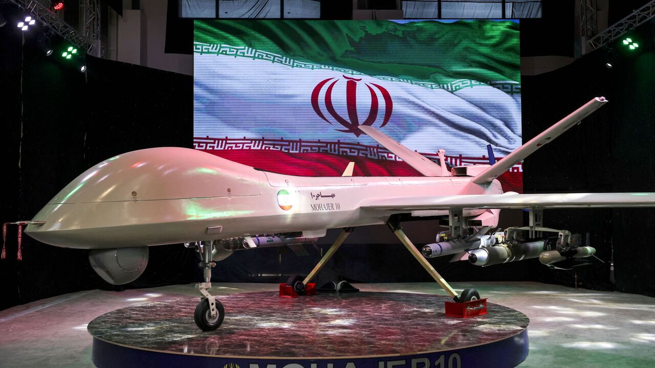 Iranian drone "Mohajer 10" is displayed Iran's defence industry achievements exhibition, on August 23, 2023 in Tehran. Iran unveiled on August 22 its latest domestically built drone that can fly at a higher altitude and for a longer duration with enhanced weapons capabilities, state media reported. (Photo by ATTA KENARE / AFP) (Photo by ATTA KENARE/AFP via Getty Images)