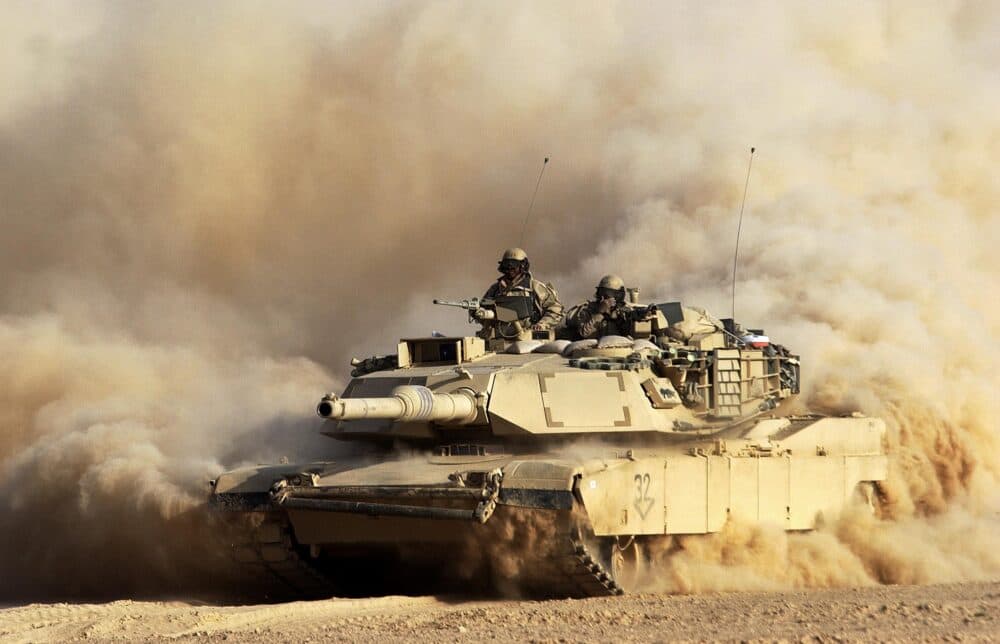 A U.S. Army 3rd Infantry Division M1/A1 Abrahams tank moves deeper into Iraqi territory March 23, 2003 south of the city of An Najaf.  U.S. and British forces continue to assault Iraq from land, sea and air as part of the ongoing Operation Iraqi Freedom. (Photo by Scott Nelson/Getty Images)