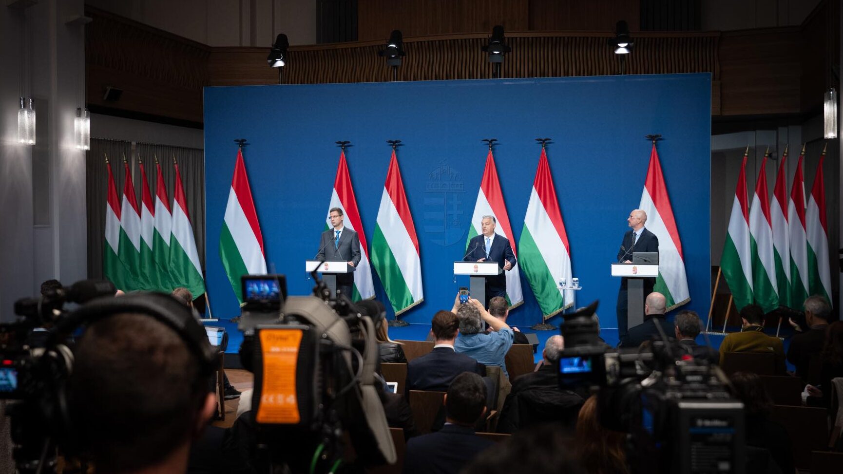 Hungarian-flags-and-Orban-and-two-more-men-e1738772232950.jpg
