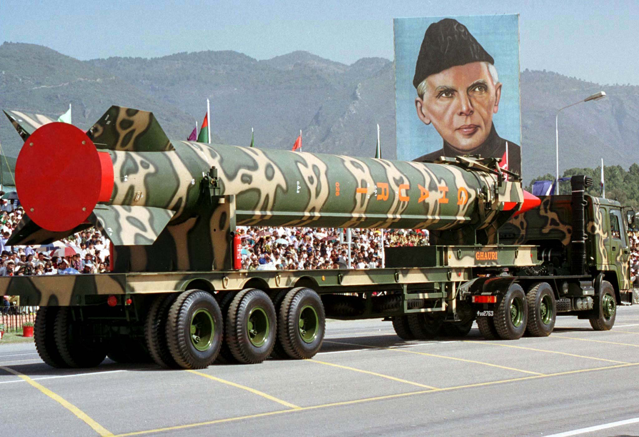 FILE PHOTO 23MAR99 - An army vehicle carrying the long range surface-to-surface &quot;Ghauri&quot; missile passes a portrait of the nation's founder Mohammad Ali Jinnah, during a military parade to mark Pakistan day in Islamabad in this March 23 file photo. Pakistan was preparing to test a missile in response to India's weekend firing of its Agni ballistic missile, sources close to the test said on April 14. Pakistan's longest-range 1,500 kilometre (937 mile) Ghauri missile, a nuclear-capable ballistic missile, was first test-fired in April last year.MP/JIR/JBP