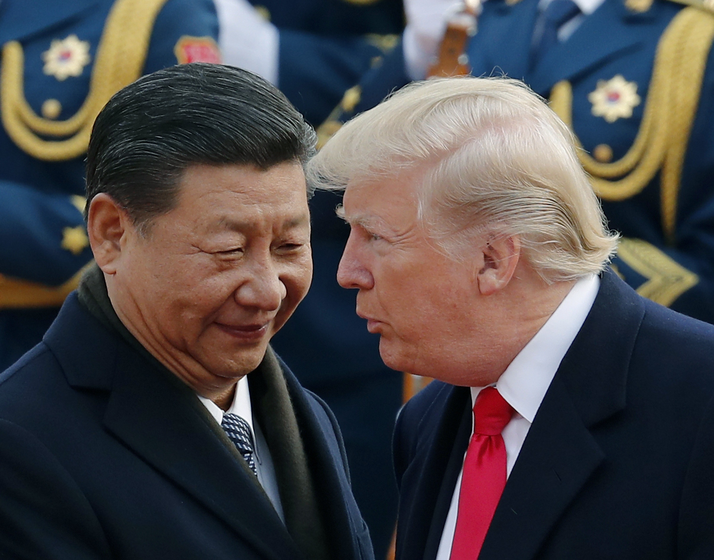 FILE - In this Nov. 9, 2017, file photo, U.S. President Donald Trump, right, chats with Chinese President Xi Jinping during a welcome ceremony at the Great Hall of the People in Beijing. Following Trump's visit to Beijing, China says it's sending a high-level special envoy to North Korea amid an extended chill in relations between the neighbors over Pyongyang's nuclear weapons and missile programs. The official Xinhua News Agency said Wednesday, Nov. 15, 2017, that director of the ruling Communist Party's International Liaison Department, Song Tao, would travel to Pyongyang on Friday to report on the party's national congress held in October. (AP Photo/Andy Wong, File)