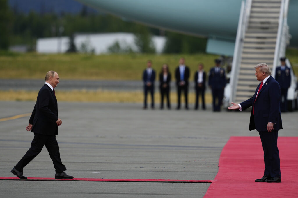 President Donald Trump greets Russia's President Vladimir Putin Friday, Aug. 15, 2025, at Joint Base Elmendorf-Richardson, Alaska. (AP Photo/Julia Demaree Nikhinson)
