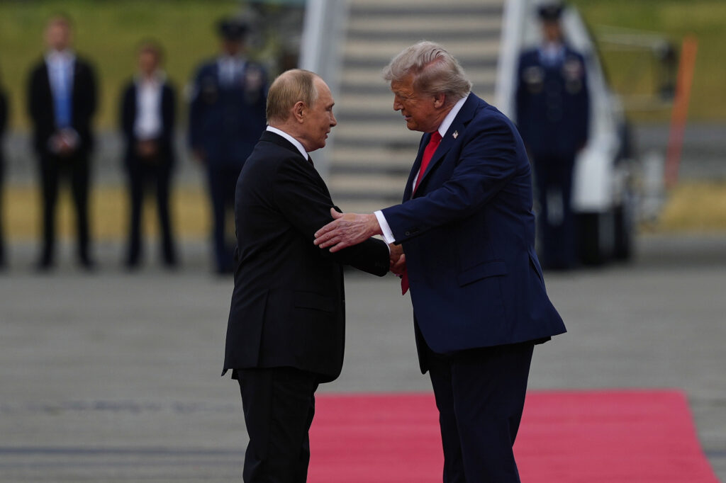 President Donald Trump greets Russia's President Vladimir Putin Friday, Aug. 15, 2025, at Joint Base Elmendorf-Richardson, Alaska. (AP Photo/Julia Demaree Nikhinson)