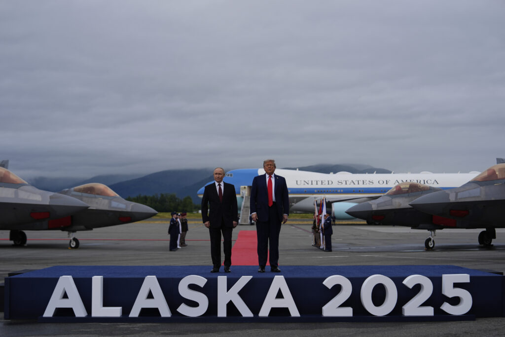 President Donald Trump greets Russia's President Vladimir Putin Friday, Aug. 15, 2025, at Joint Base Elmendorf-Richardson, Alaska. (AP Photo/Julia Demaree Nikhinson)