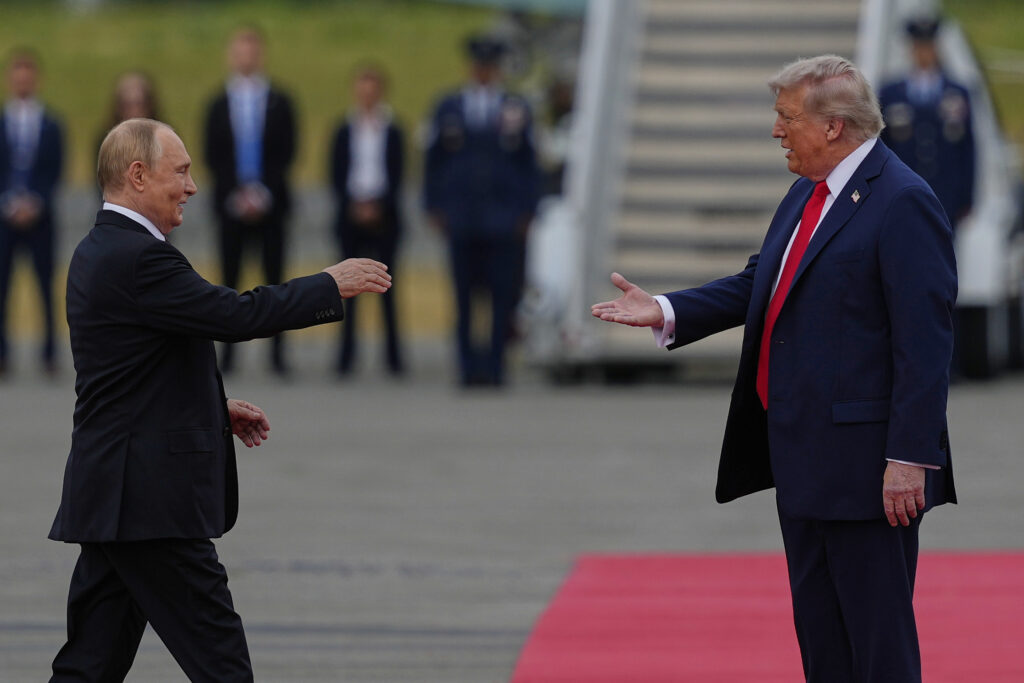 President Donald Trump greets Russia's President Vladimir Putin Friday, Aug. 15, 2025, at Joint Base Elmendorf-Richardson, Alaska. (AP Photo/Julia Demaree Nikhinson)