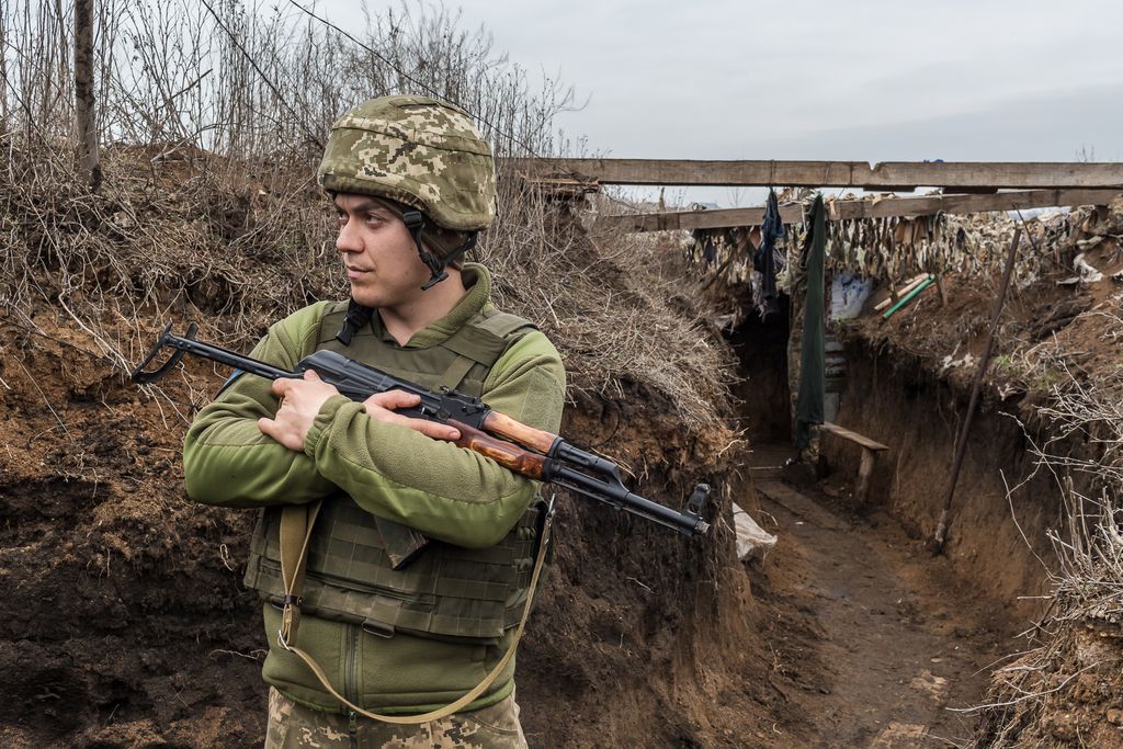 A soldier, whose nom de guerre is Voron, stands in the trenches of the Ukrainian army frontline position in Chermalyk, Donetsk region, Ukraine on April 13, 2021. In recent weeks the fighting between Ukrainian army and Russia-backed separatists has int