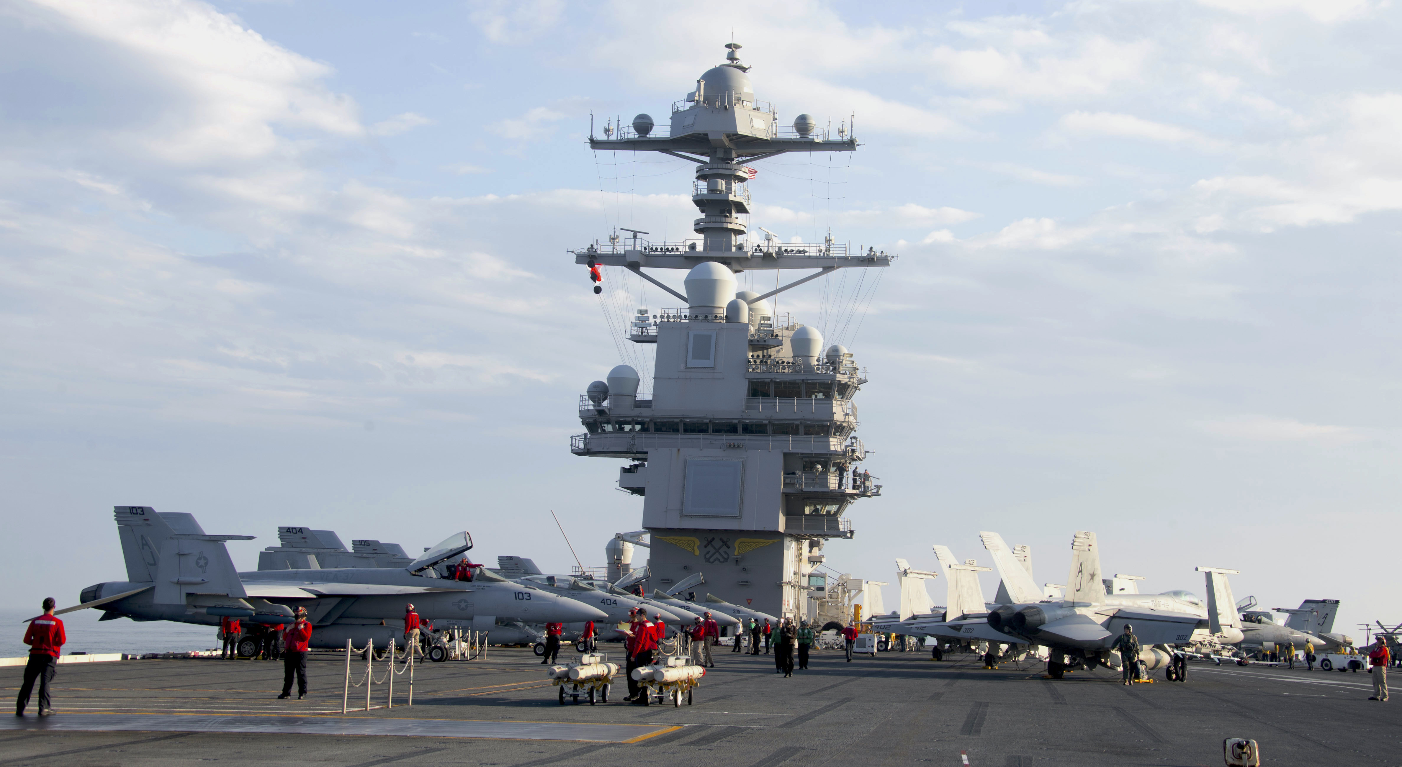 Sailors prepare aircraft for flight operations on USS Gerald R. Ford's (CVN 78) flight deck May 30, 2020. Ford is underway in the Atlantic Ocean conducting integrated air wing operations. (U.S. Navy photo by Mass Communication Specialist Seaman Angel Thuy Jaskuloski)