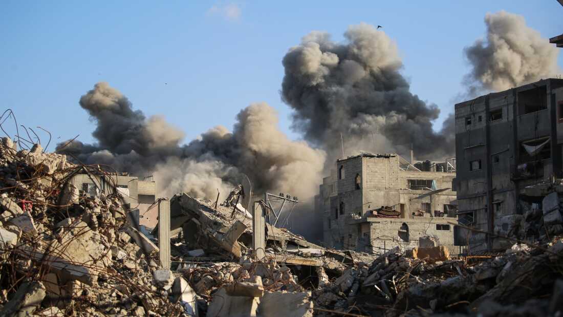 Smoke billows following an Israeli strike that targeted a building in the Bureij camp for Palestinian refugees in the central Gaza Strip on October 19, 2025. Gaza's civil defence agency said a series of Israeli air strikes on October 19 killed at least 11 people across the territory, as Israel and Hamas traded blame for violating a ceasefire. (Photo by Eyad BABA / AFP)