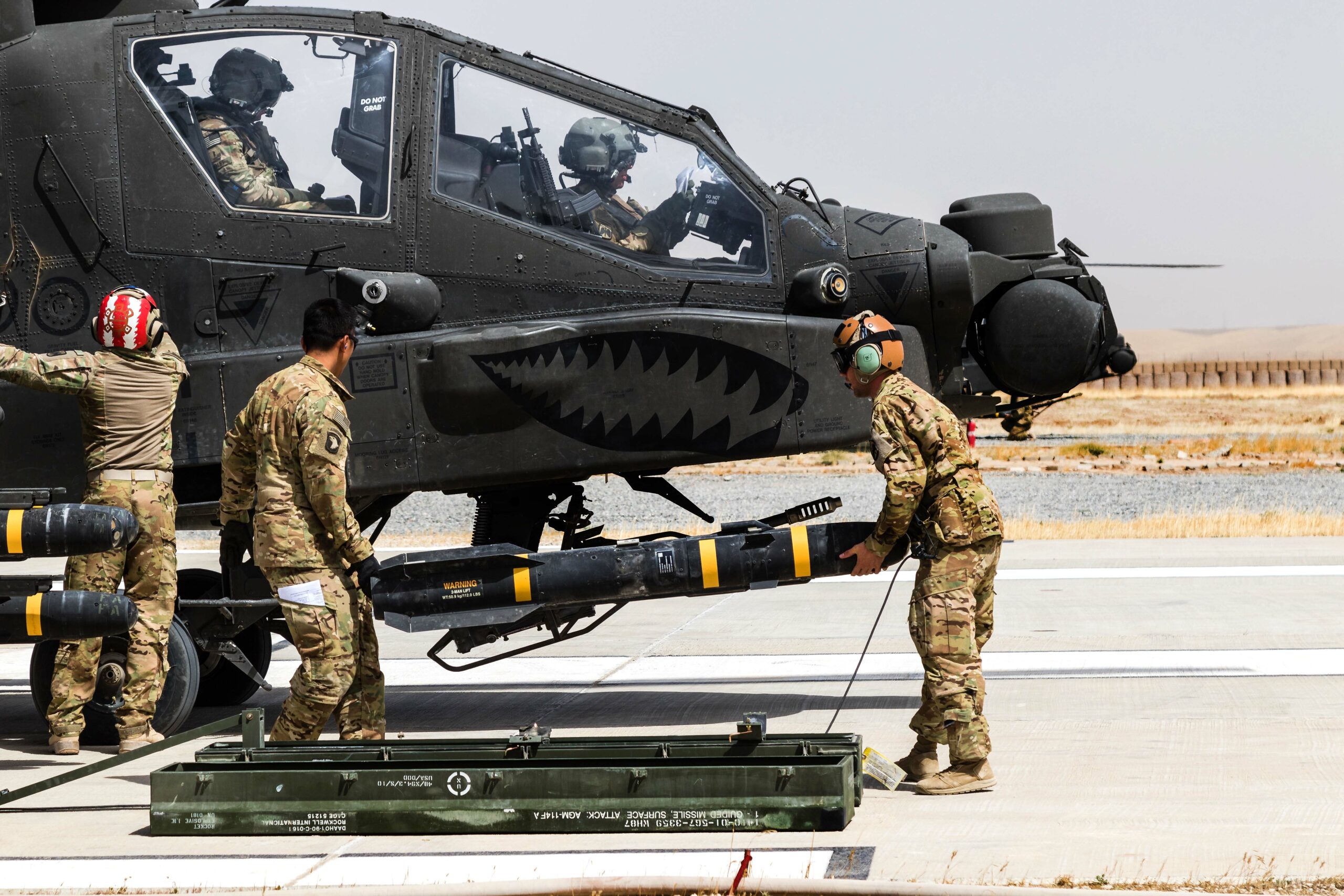 U.S. Army Soldiers assigned to Task Force Griffin, 16th Combat Aviation Brigade, 7th Infantry Division load an AGM-114 Hellfire missile on an AH-64E Apache helicopter in Kunduz, Afghanistan, May 31, 2017. The Griffins are working hard to support U.S. Forces Afghanistan as part of Operation Freedom's Sentinel and Resolute Support Mission.