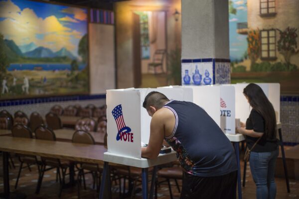 LOS ANGELES, CA - NOVEMBER 08: Latinos vote at a polling station in El Gallo Restaurant on November 8, 2016 in the Boyle Heights section of Los Angeles, United States. In addition to choosing between Republican Donald Trump or Democrat Hillary Clinton for President of the United States, Californians are deciding on 17 ballot propositions.   (Photo by David McNew/Getty Images)