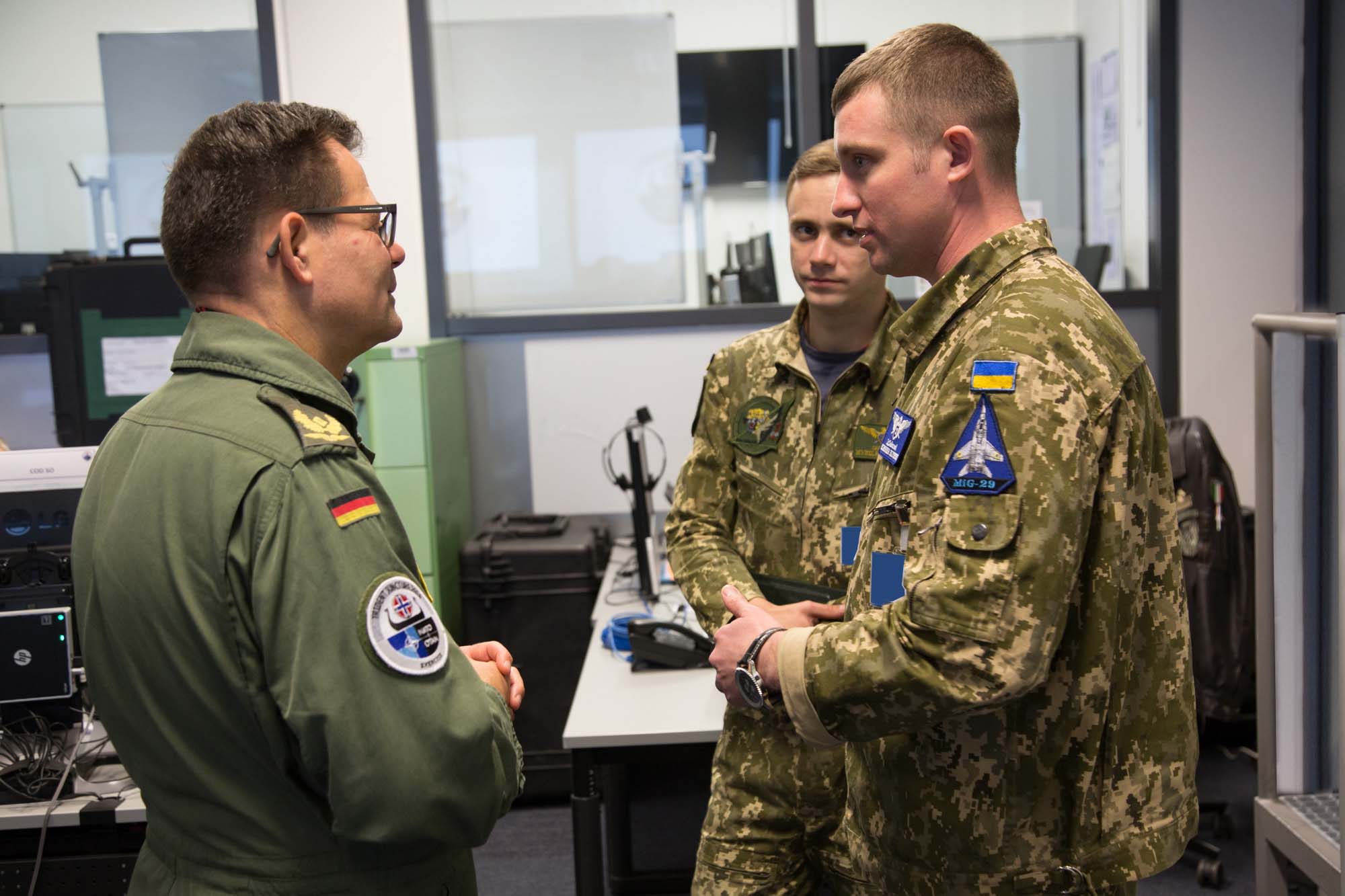 BGen Karsten Stoye, Deputy Chief of Staff Operations (DCOS OPS), discussing with two Ukrainian Mig29 Pilots during Exercise Trident Juncture 18 CPX.