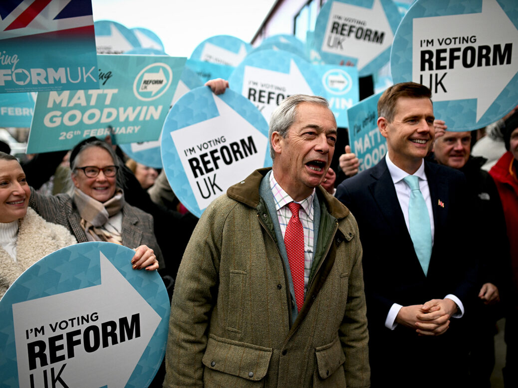 Reform UK candidate Matt Goodwin (R) and Reform UK leader Nigel Farage open the Gorton and Denton Reform UK campaign office, northwest England on February 5, 2026, ahead of the February 26 Gorton and Denton by-election. (Photo by Oli SCARFF / AFP via Getty Images)