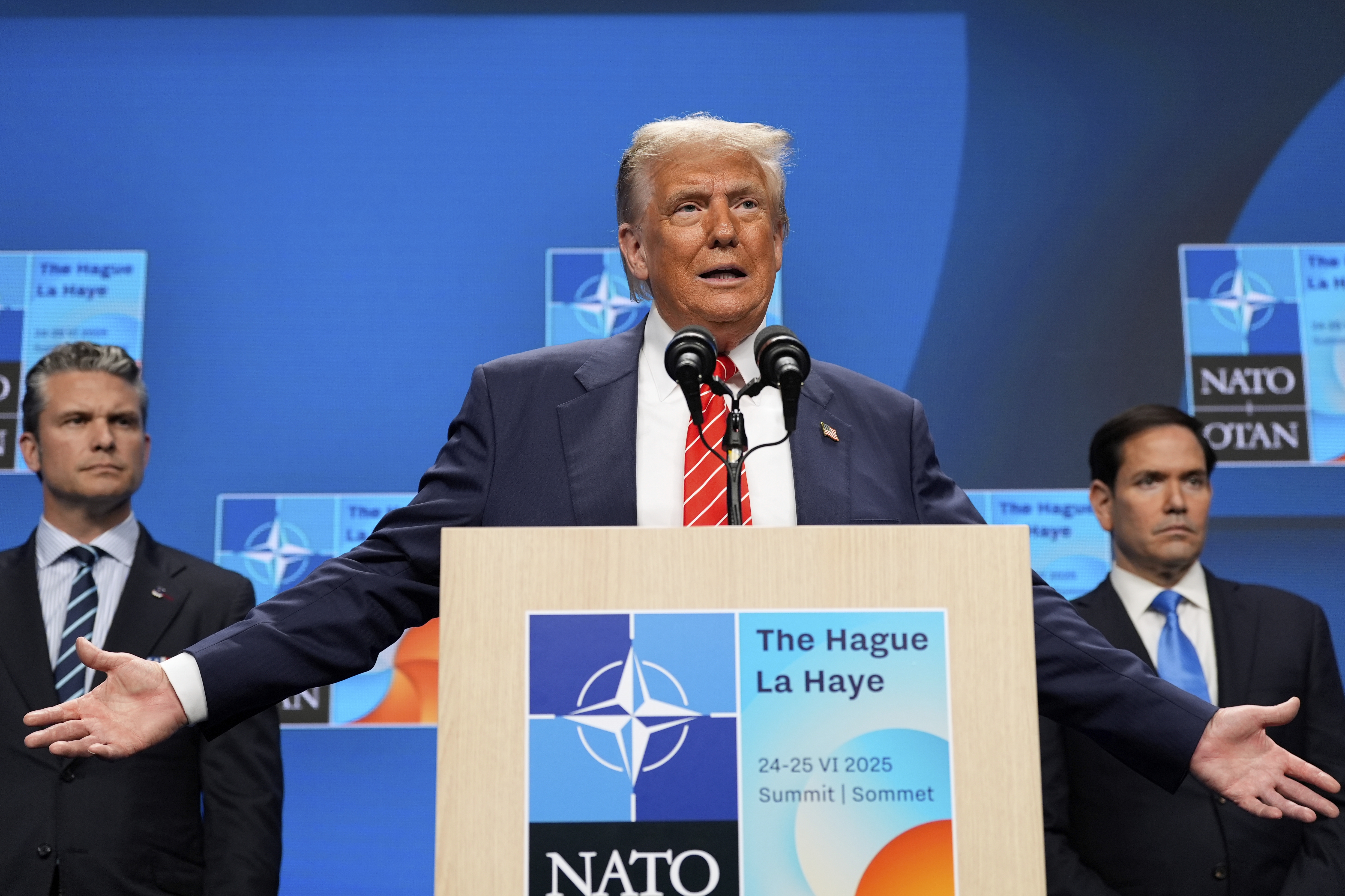 President Donald Trump speaks during a media conference at the end of the NATO summit as Foreign Secretary Marco Rubio, right, and Defence Secretary Pete Hegseth listen, in The Hague, Netherlands, Wednesday, June 25, 2025. (AP Photo/Alex Brandon)