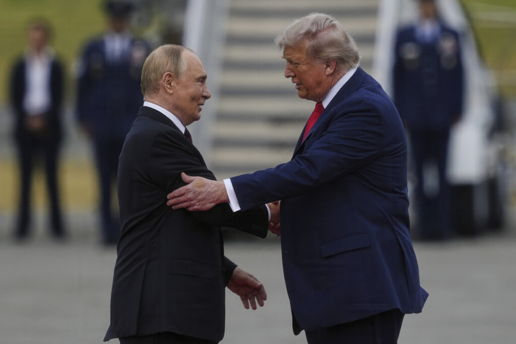 President Donald Trump greets Russia's President Vladimir Putin Friday, Aug. 15, 2025, at Joint Base Elmendorf-Richardson, Alaska. (AP Photo/Julia Demaree Nikhinson)