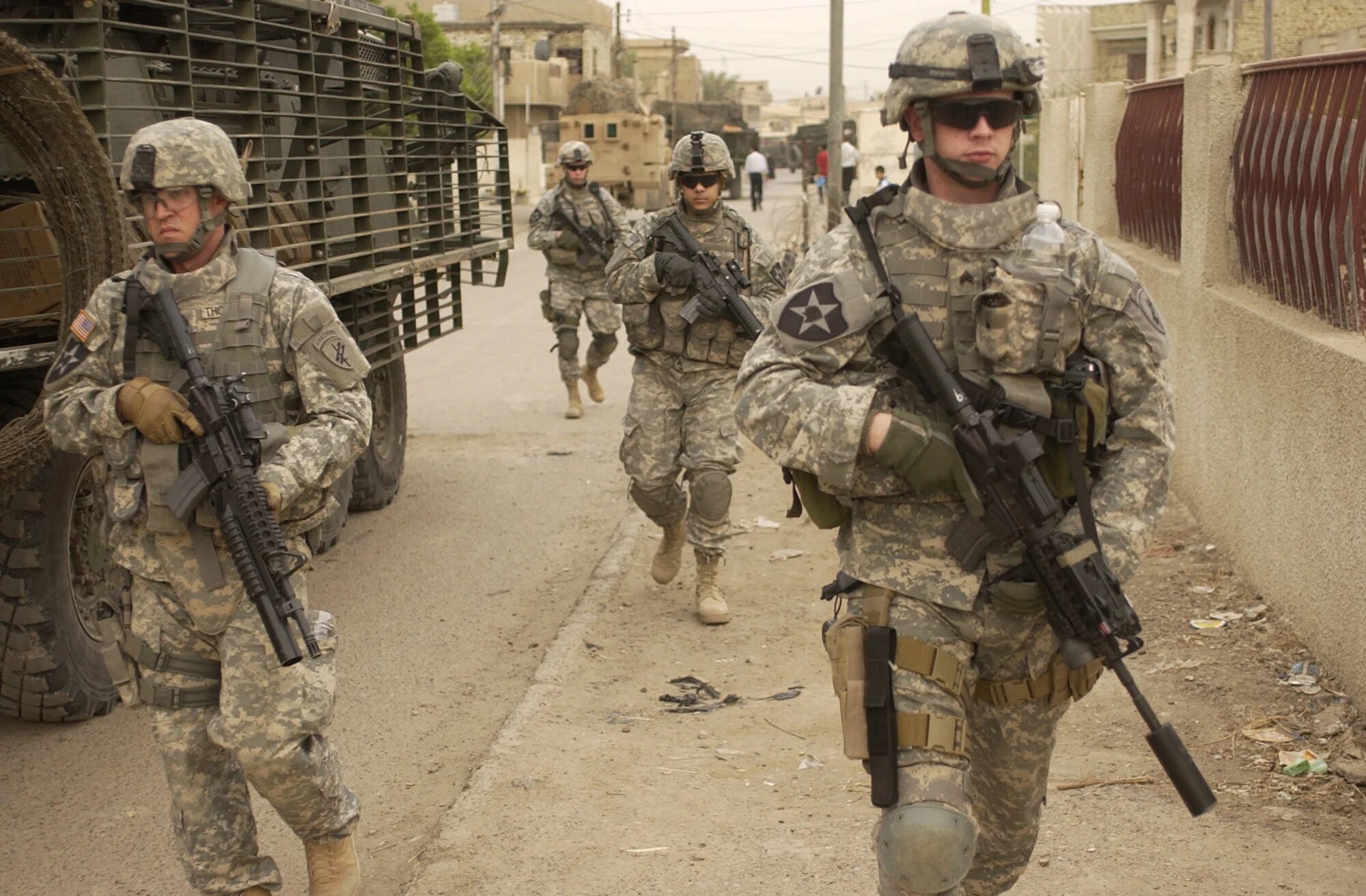 070403-A-3887D-003U.S. Army soldiers move down a street as they start a clearing mission in Dora, Iraq, on May 3, 2007.  Soldiers from the 2nd Platoon, Alpha Company, 2nd Battalion, 3rd Infantry Regiment, 3rd Stryker Brigade Combat Team, 2nd Infantry Division are patrolling the streets in Dora.  DoD photo by Spc. Elisha Dawkins, U.S. Army. (Released)
