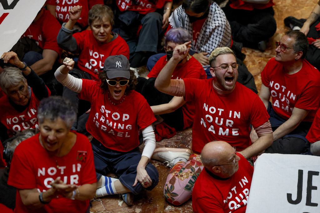 Demonstrators from the group, Jewish Voice for Peace, protest inside Trump Tower in support of Columbia graduate student Mahmoud Khalil, Thursday, March 13, 2025, in New York. (AP Photo/Yuki Iwamura)
