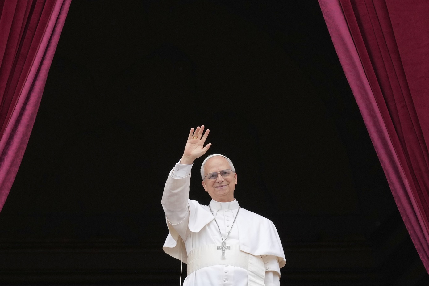 Pope Leo XIV appears on the central balcony of St. Peter's Basilica at the Vatican to bless the crowd below on May 11, 2025. (AP Photo/Gregorio Borgia)