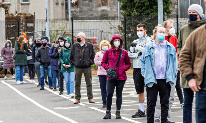 People wait in a queue to receive a swab test for Covid-19 at a walk-in portable testing centre operated by the ambulance service in Dublin, Ireland on March 25, 2021, as the country struggles to reduce the spread of coronavirus. (Photo by Paul Faith / AFP) (Photo by PAUL FAITH/AFP via Getty Images)