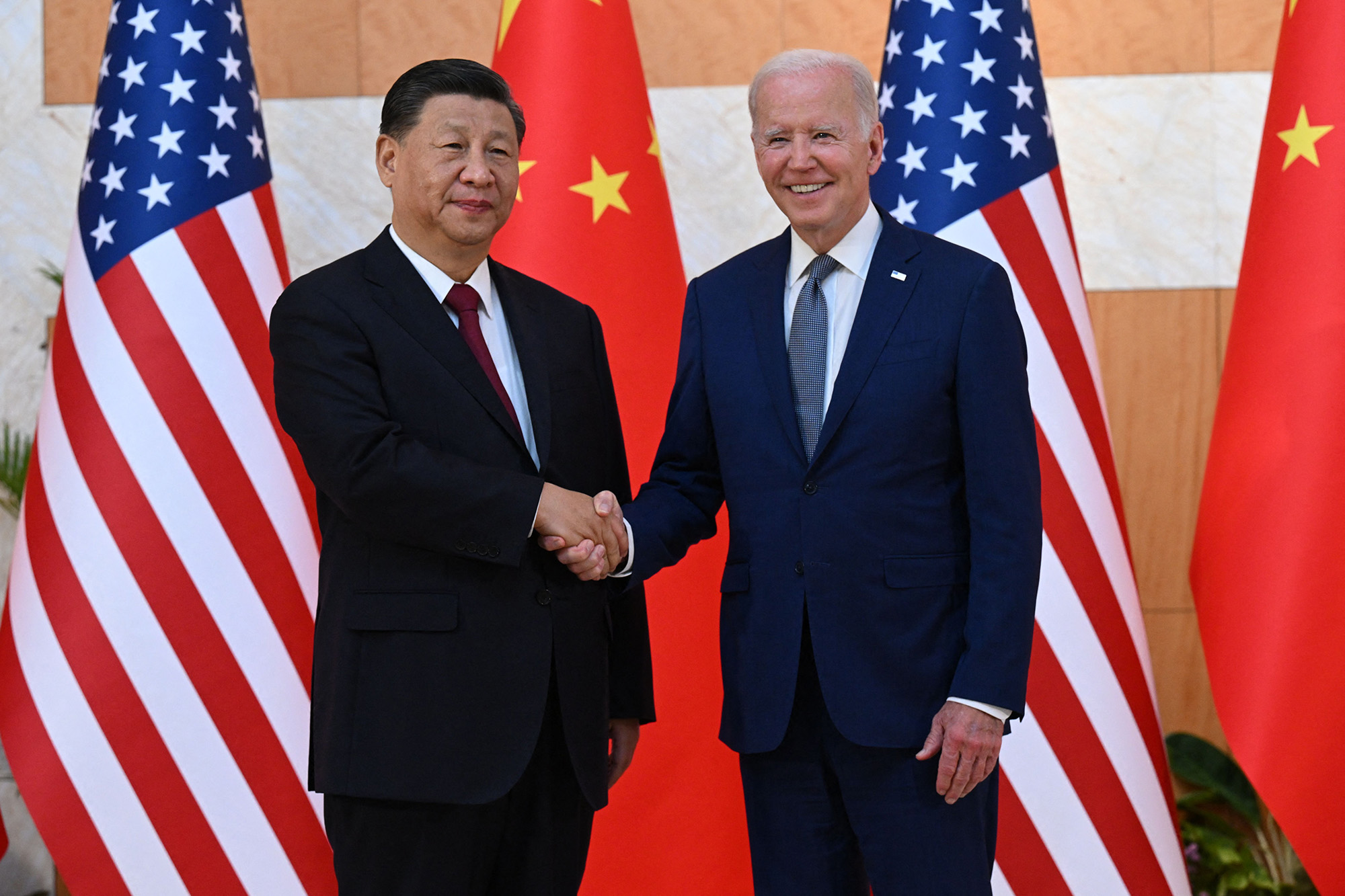 US President Joe Biden (R) and China's President Xi Jinping (L) shakes hands as they meet on the sidelines of the G20 Summit in Nusa Dua on the Indonesian resort island of Bali on November 14, 2022. (Photo by SAUL LOEB / AFP) (Photo by SAUL LOEB/AFP via Getty Images)