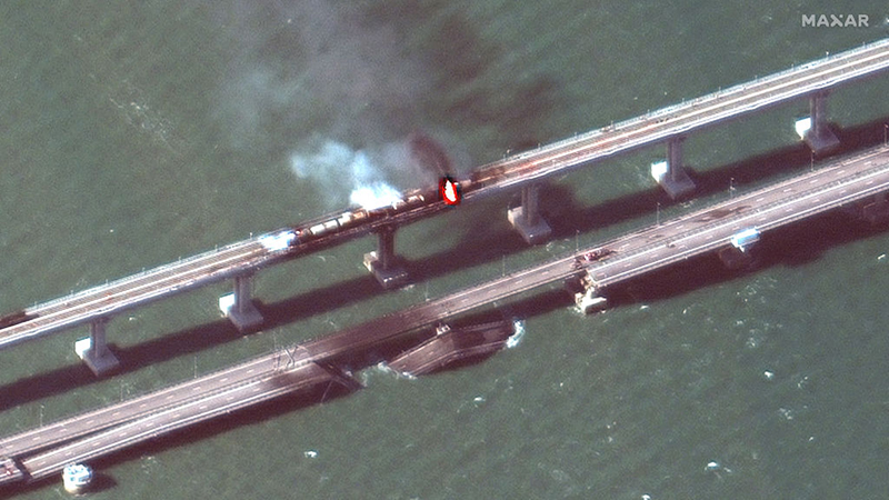 KERCH BRIDGE, CRIMEA -- OCTOBER 8, 2022:  03 Maxar closeup satellite imagery of burning rail cars and the damage to the Kerch Bridge in Crimea.  Please use: Satellite image (c) 2022 Maxar Technologies.
