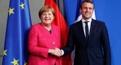 Ο Macron συνεχάρη τη Merkel και το SPD για τη νέα κυβερνητική συμφωνία στη Γερμανία